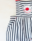 Striped overalls with red pom-pom from Yves Saint Laurent | 12-18 months