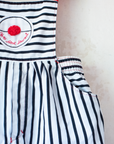 Striped overalls with red pom-pom from Yves Saint Laurent | 12-18 months