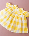 שמלה משובצת בצהוב ולבן | 12-18 חודשים