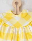 שמלה משובצת בצהוב ולבן | 12-18 חודשים