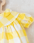 שמלה משובצת בצהוב ולבן | 12-18 חודשים