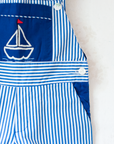 Overalls with blue stripes and an embroidered sailboat | 18-24 months
