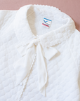 White quilted jacket with large bow tie | 6-7 years
