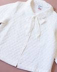 White quilted jacket with large bow tie | 6-7 years