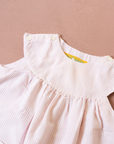 Pink and white striped dress with a goose pocket | 9-12 months