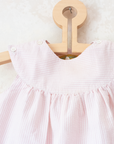 Pink and white striped dress with a goose pocket | 9-12 months