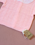Pink knit with lace collar and bows on shoulders | Spanish deadstock | 12-18 months