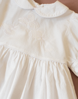 שמלה לבנה מבית איב סאן לורן עם צדפות רקומות | 12-18 חודשים