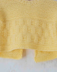 עליונית צהובה סרוגה בעבודת יד | 3-6 חודשים