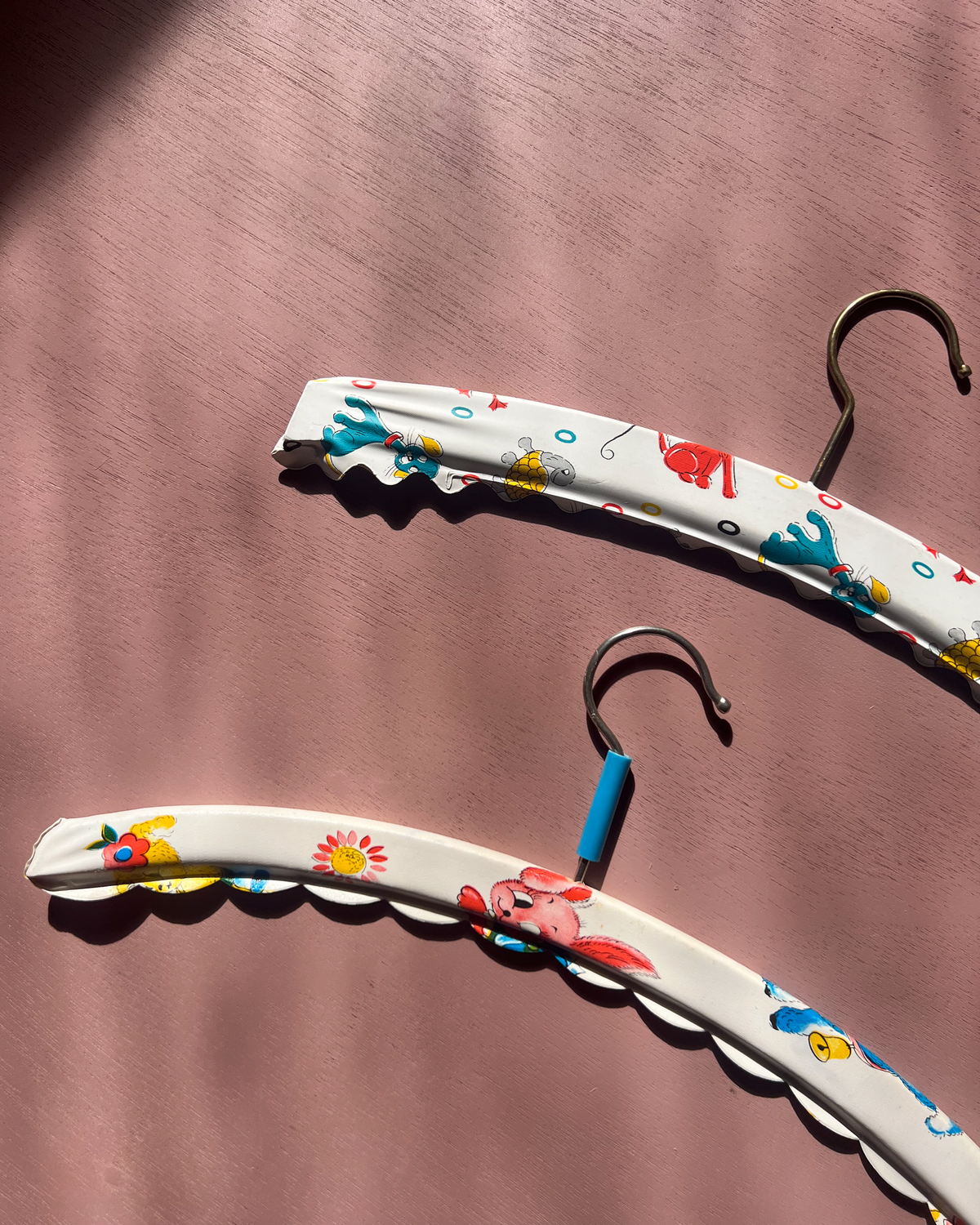 A pair of children's hangers from the 1970s 