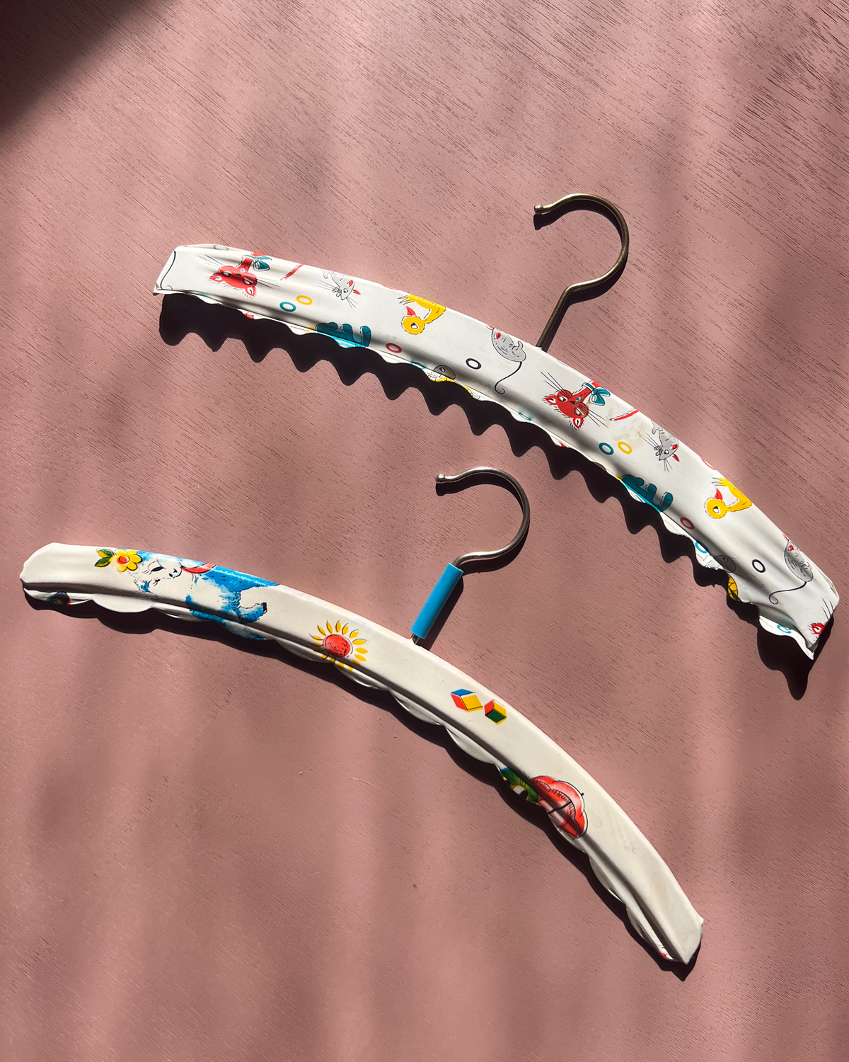 A pair of children's hangers from the 1970s 