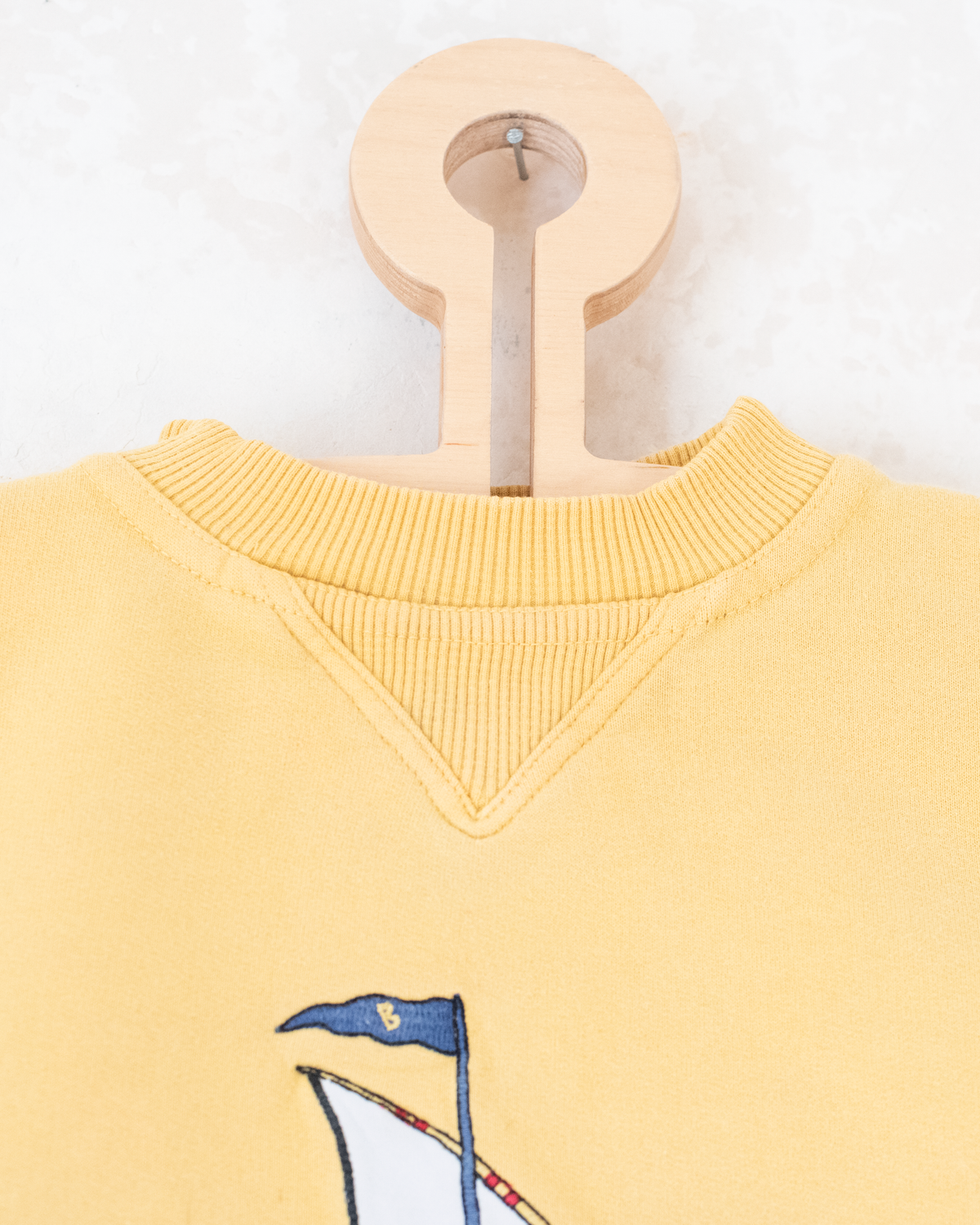 Yellow sweatshirt with embroidery of a bear sailing in a boat | 9-12 months