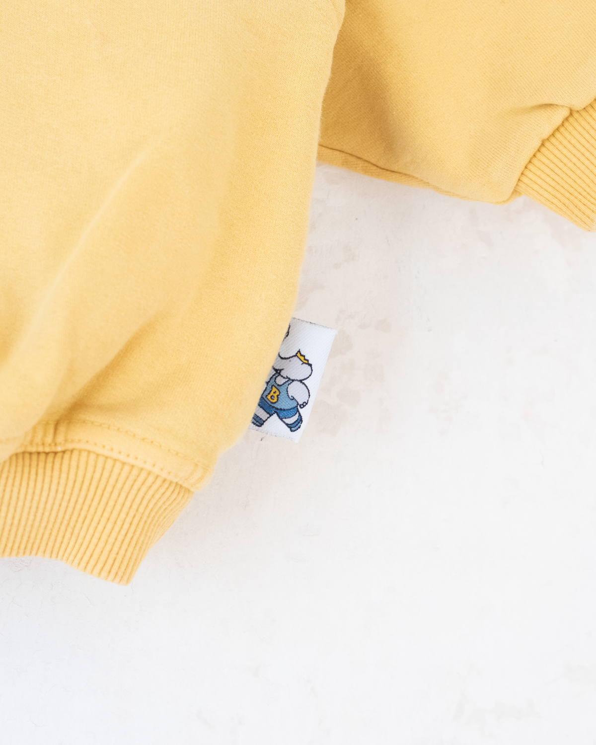 Yellow sweatshirt with embroidery of a bear sailing in a boat | 9-12 months