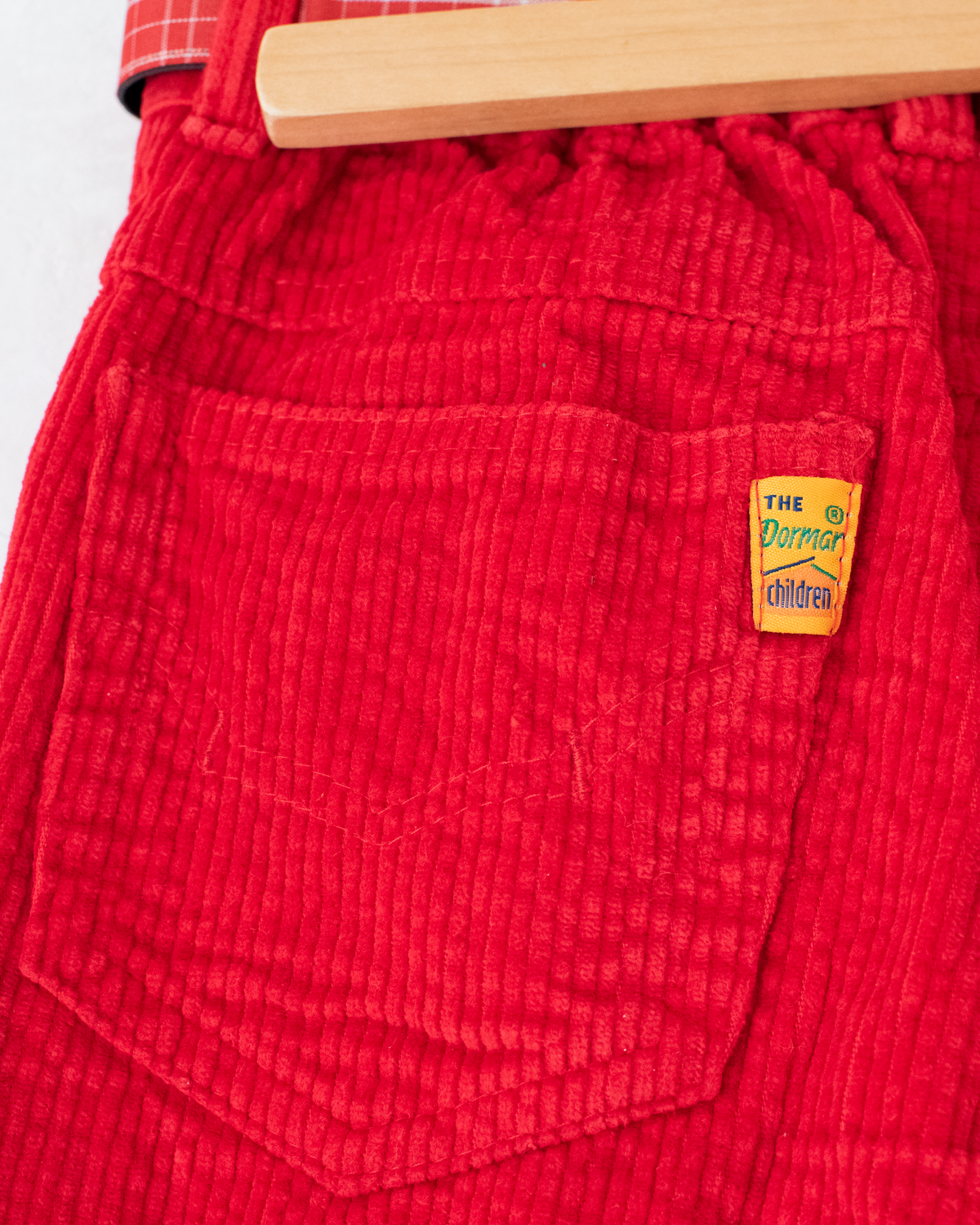 Red corduroy pants with a checkered belt from the 70s | 7-8 years