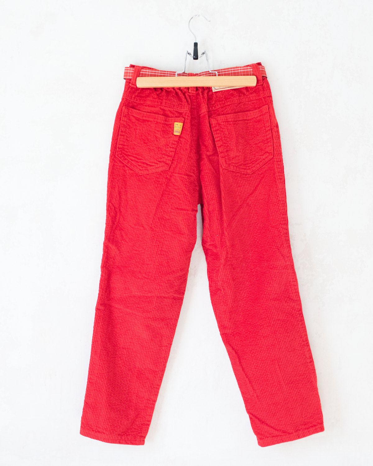 Red corduroy pants with a checkered belt from the 70s | 7-8 years