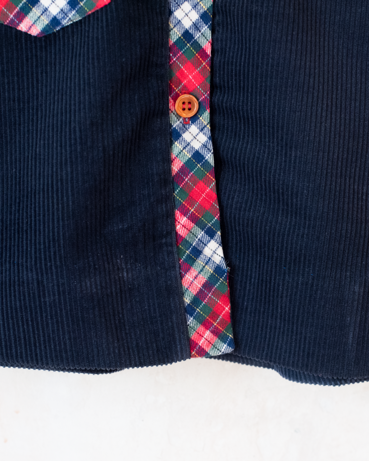 Corduroy dress with checks and pompoms | 3-4 years