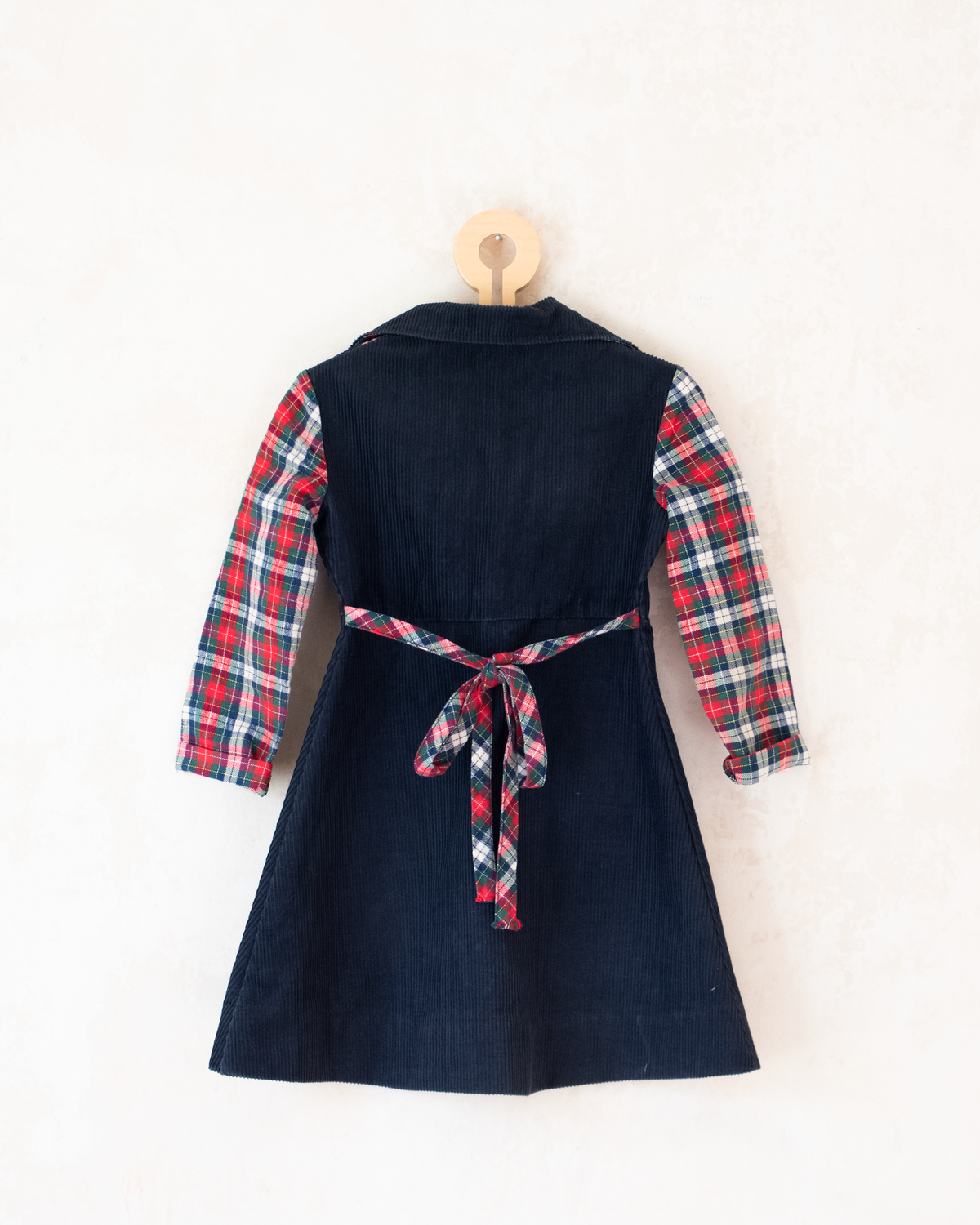 Corduroy dress with checks and pompoms | 3-4 years