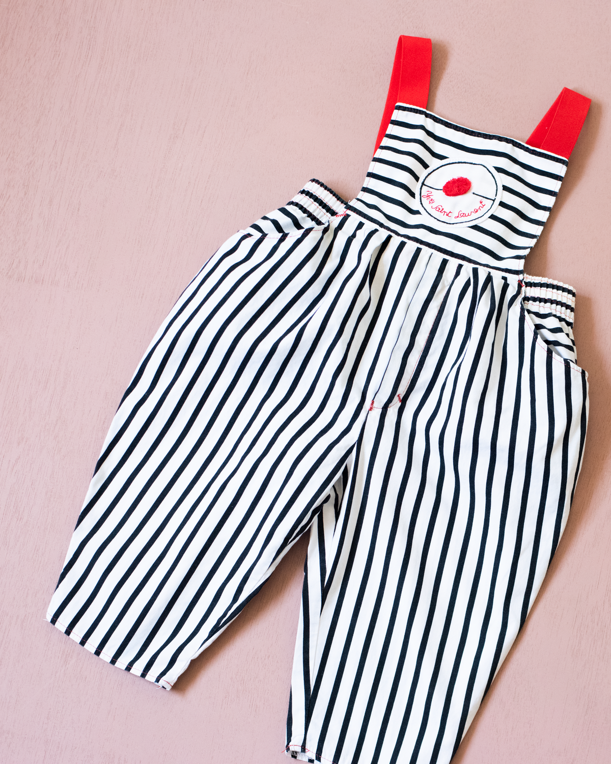 Striped overalls with red pom-pom from Yves Saint Laurent | 12-18 months