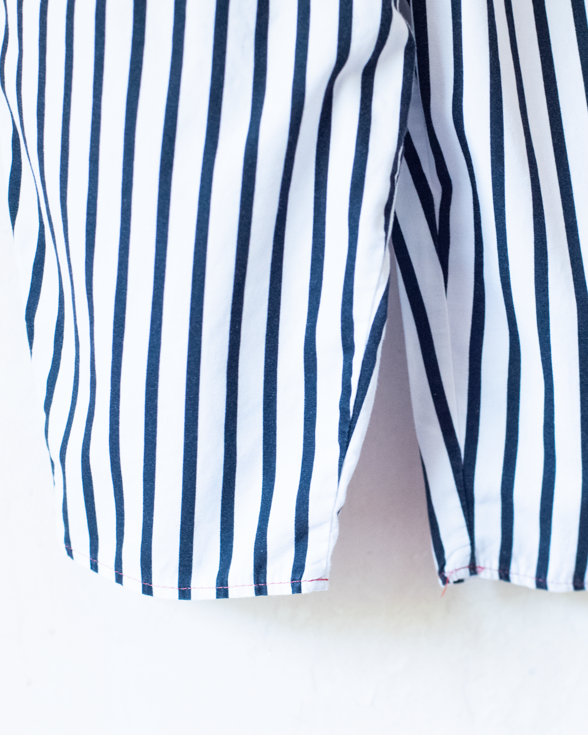 Striped overalls with red pom-pom from Yves Saint Laurent | 12-18 months