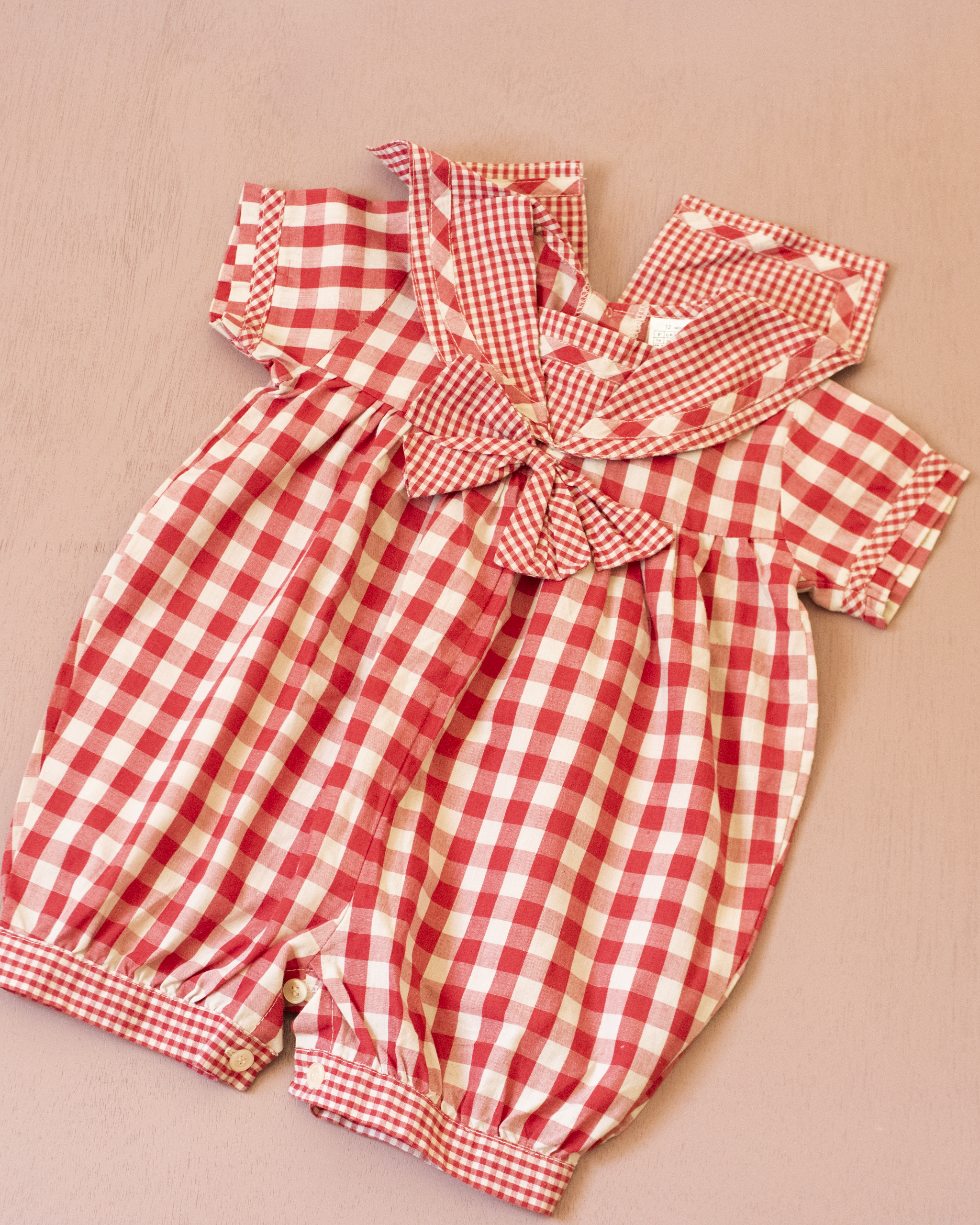 Red plaid romper with bow | 9-12 months
