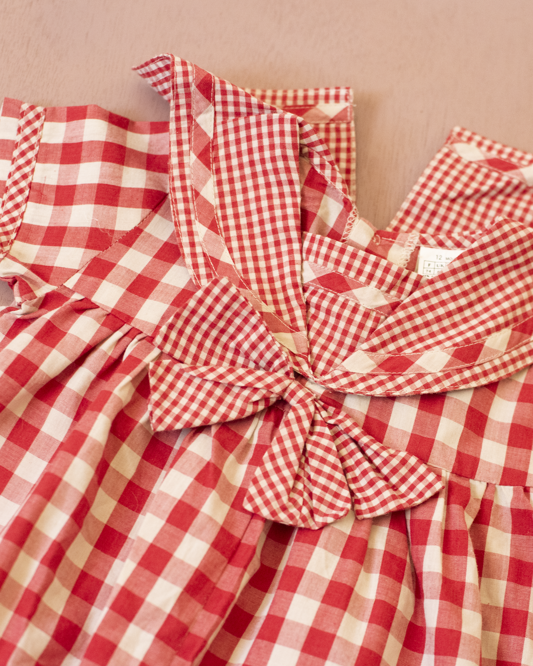 Red plaid romper with bow | 9-12 months