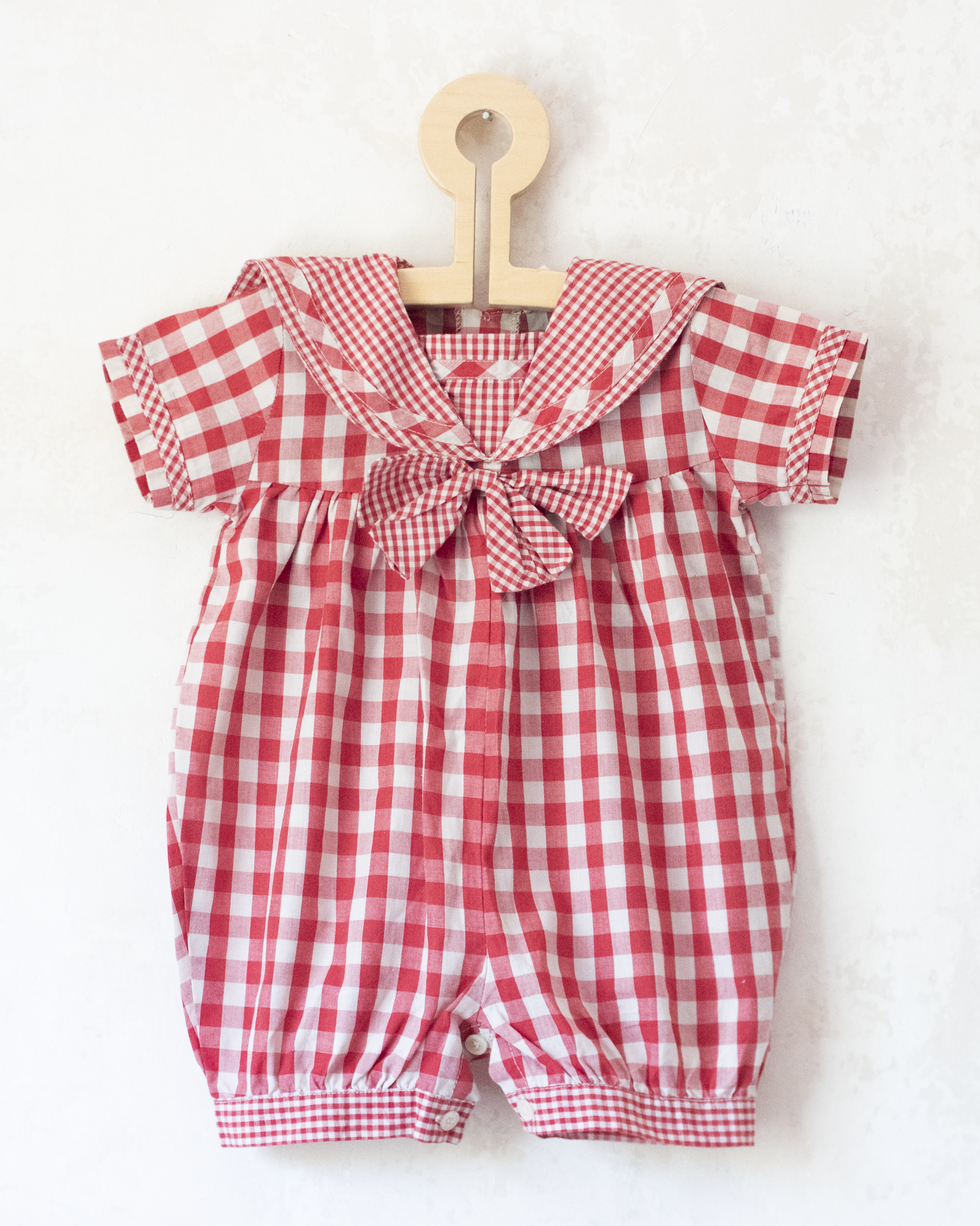 Red plaid romper with bow | 9-12 months