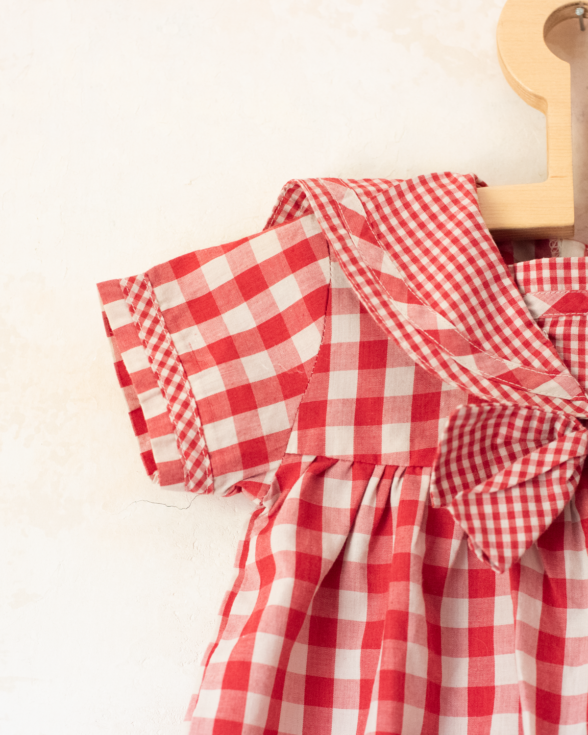 Red plaid romper with bow | 9-12 months