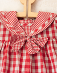 Red plaid romper with bow | 9-12 months
