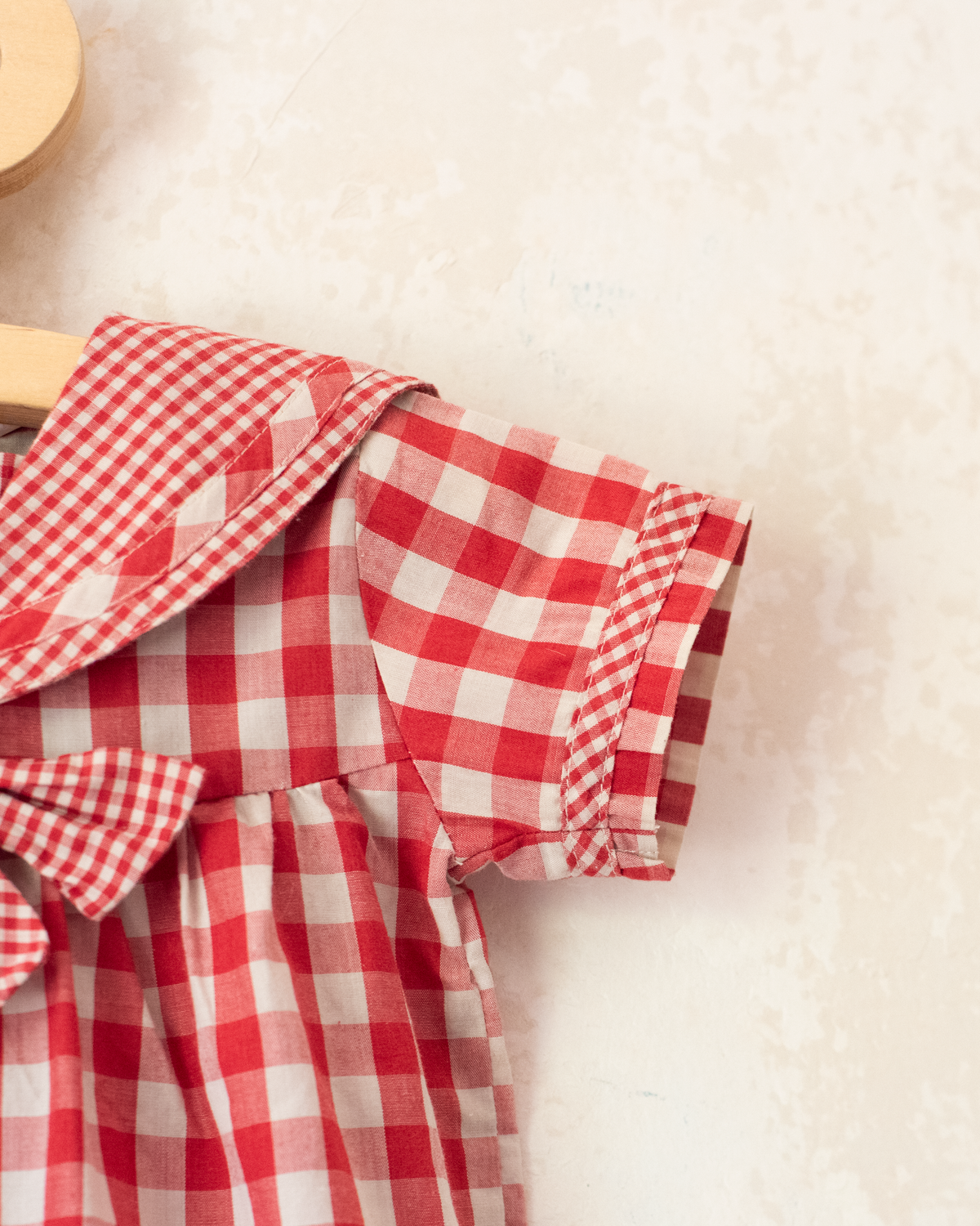 Red plaid romper with bow | 9-12 months