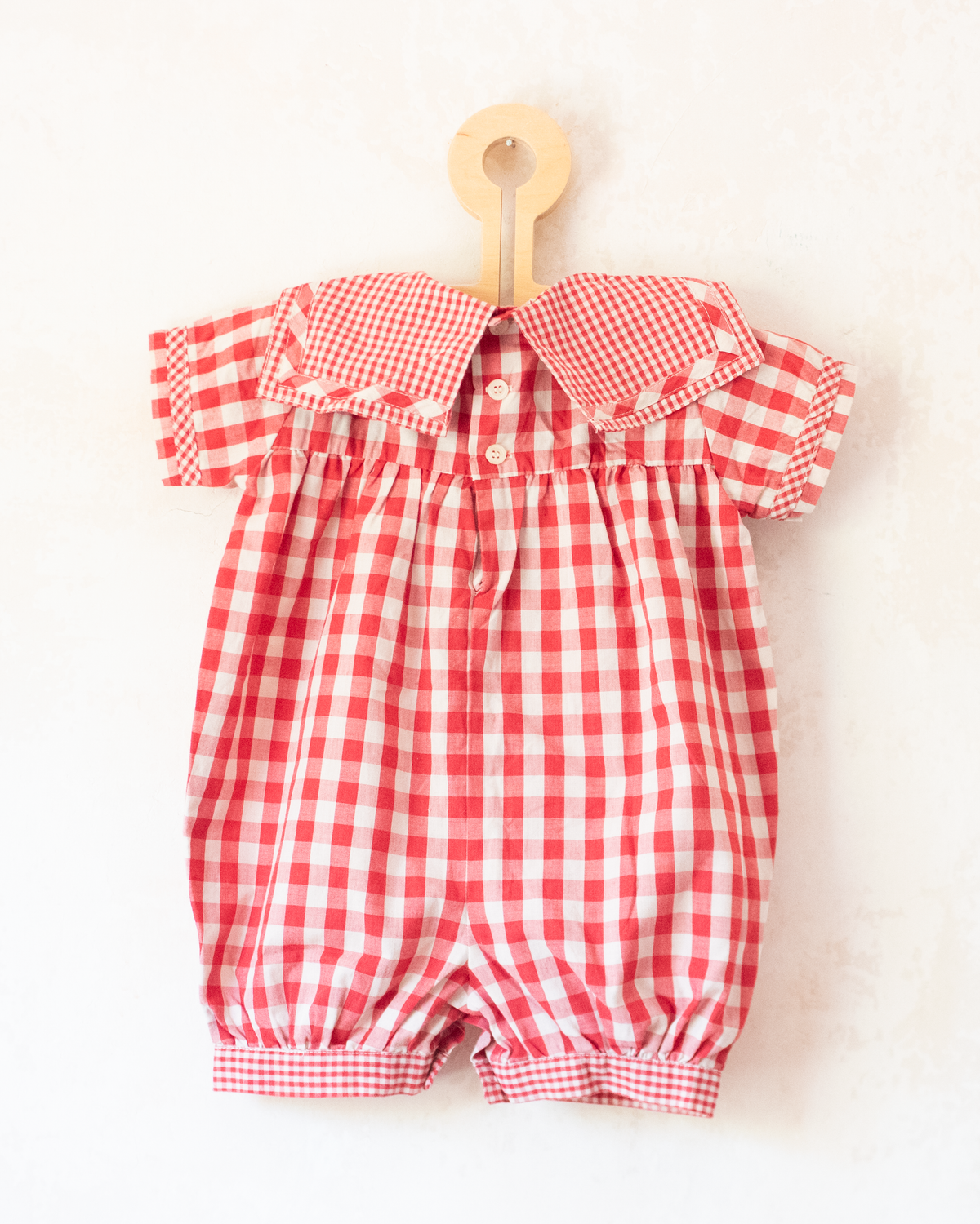 Red plaid romper with bow | 9-12 months