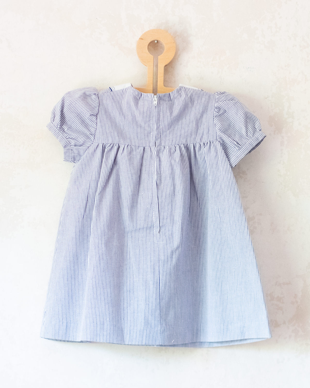 Striped dress with sailboats embroidered on the collar | 9-12 months