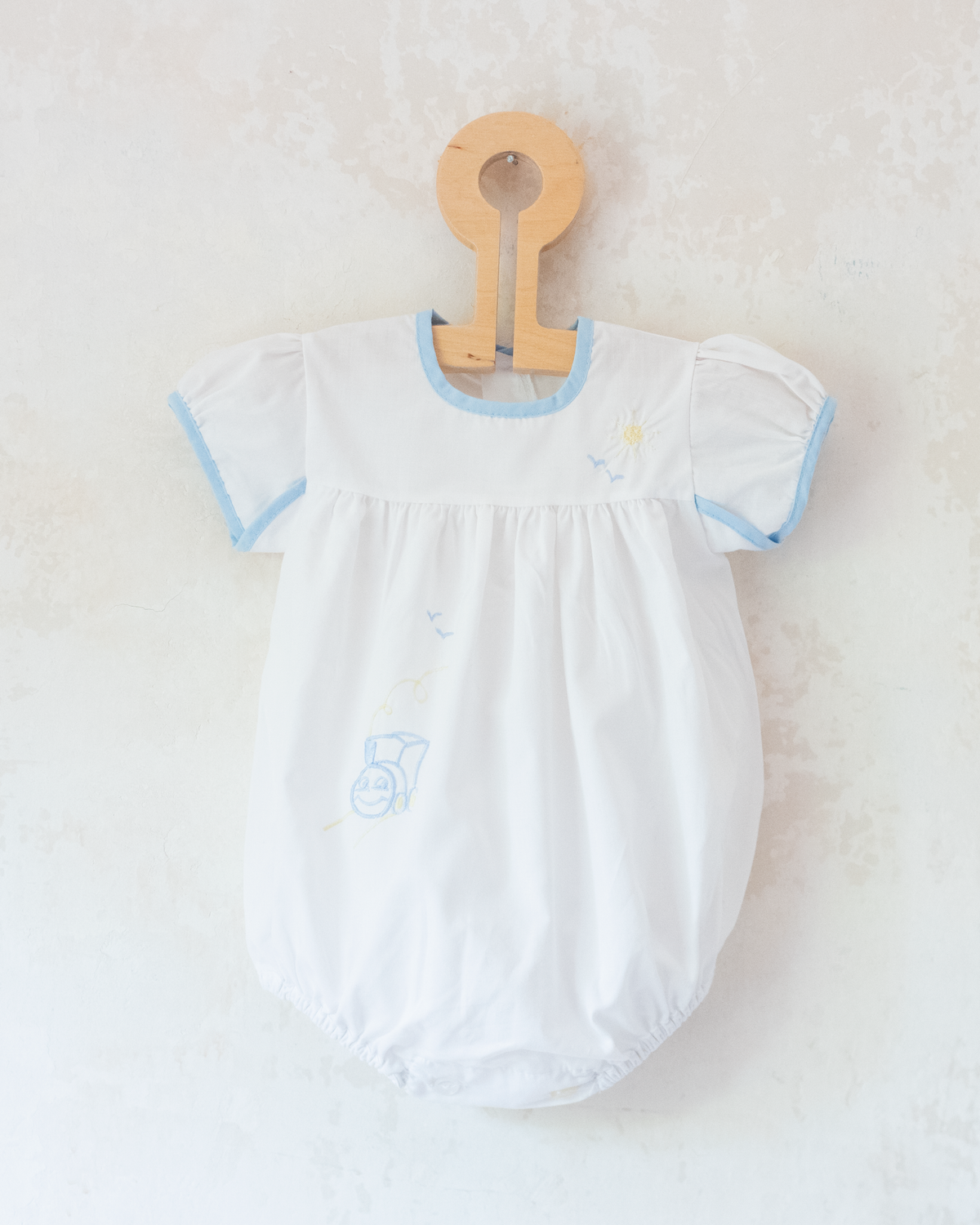 White overalls with train embroidery, birds and sun | 3-6 months