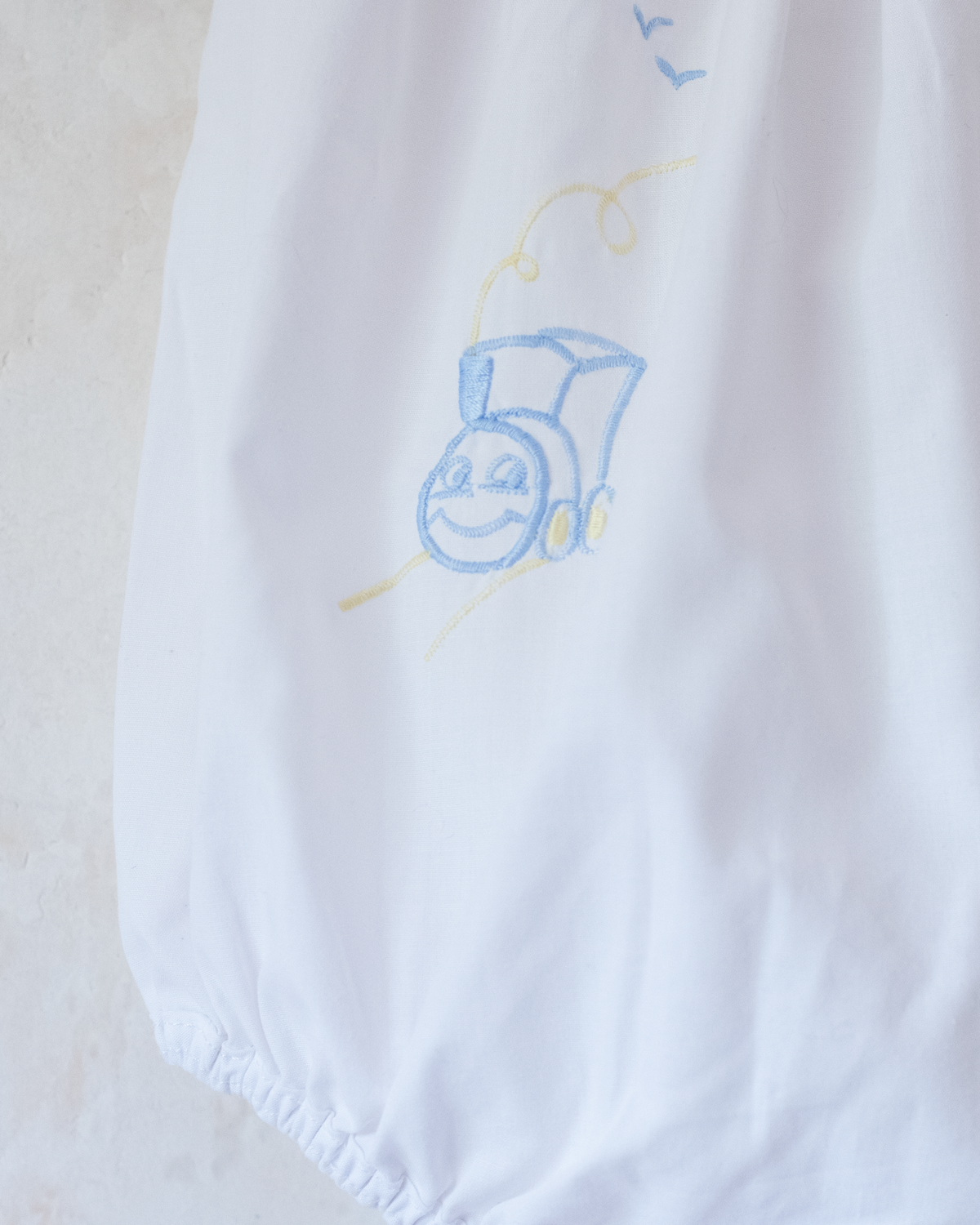White overalls with train embroidery, birds and sun | 3-6 months