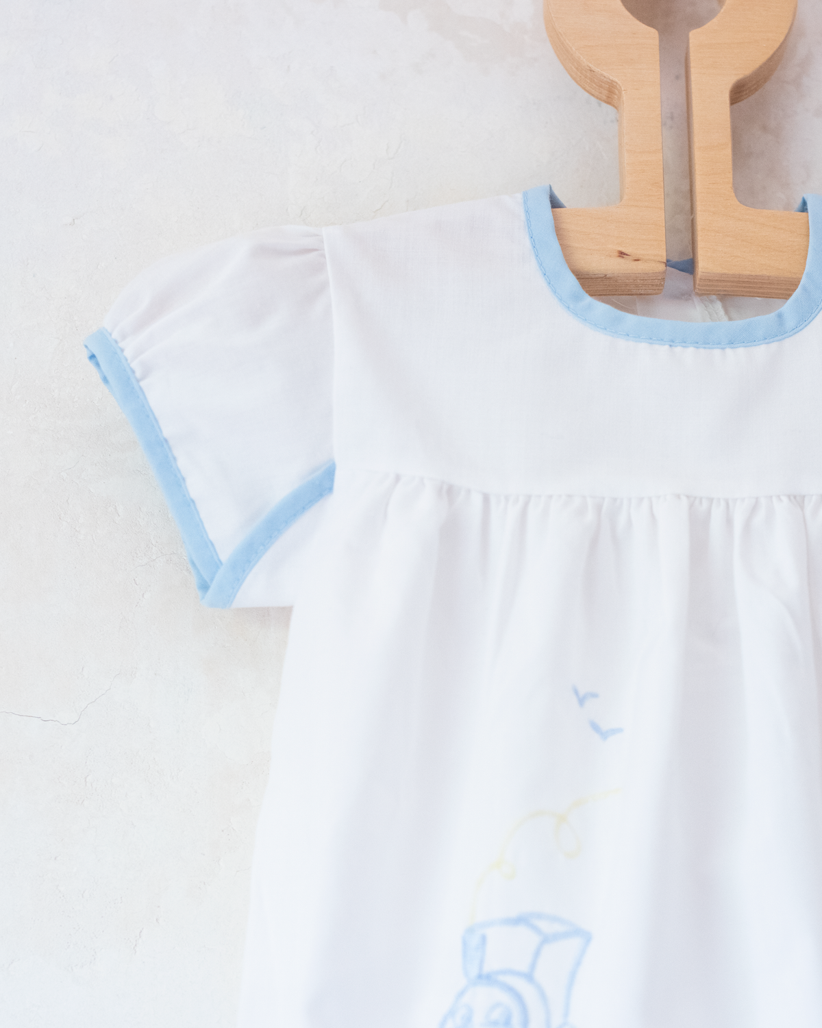 White overalls with train embroidery, birds and sun | 3-6 months
