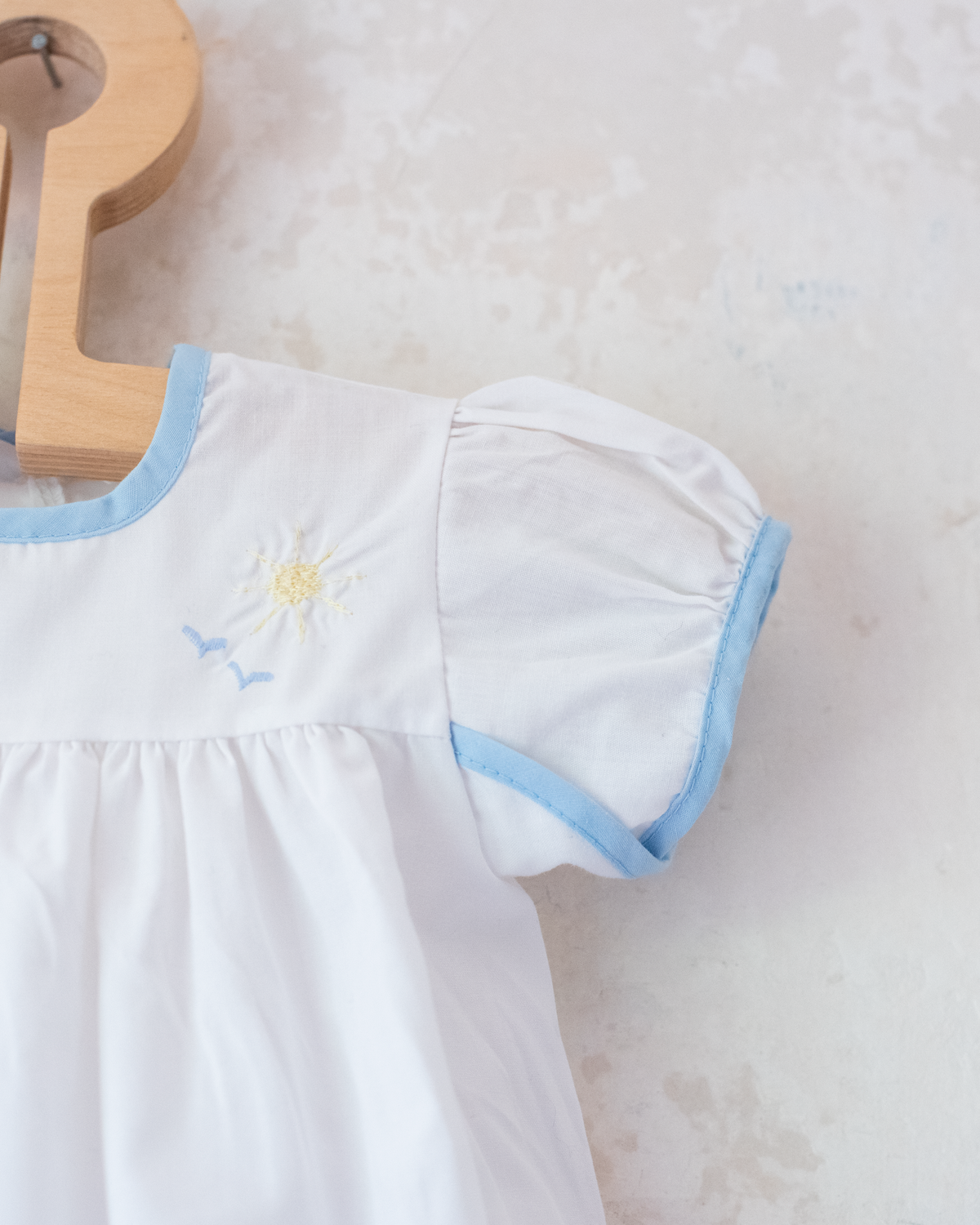 White overalls with train embroidery, birds and sun | 3-6 months