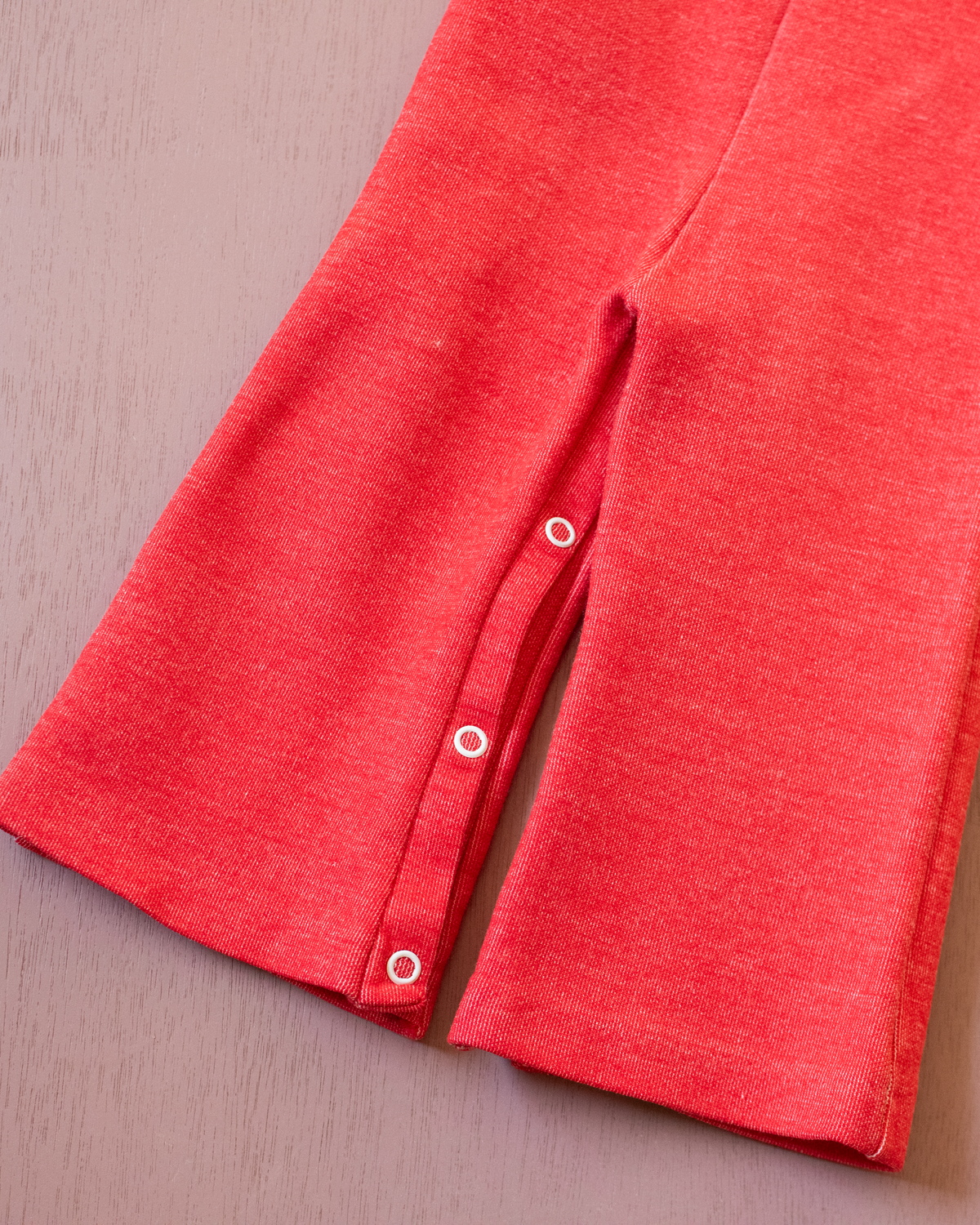 Red 70s jumpsuit with white elephant | 6-9 months