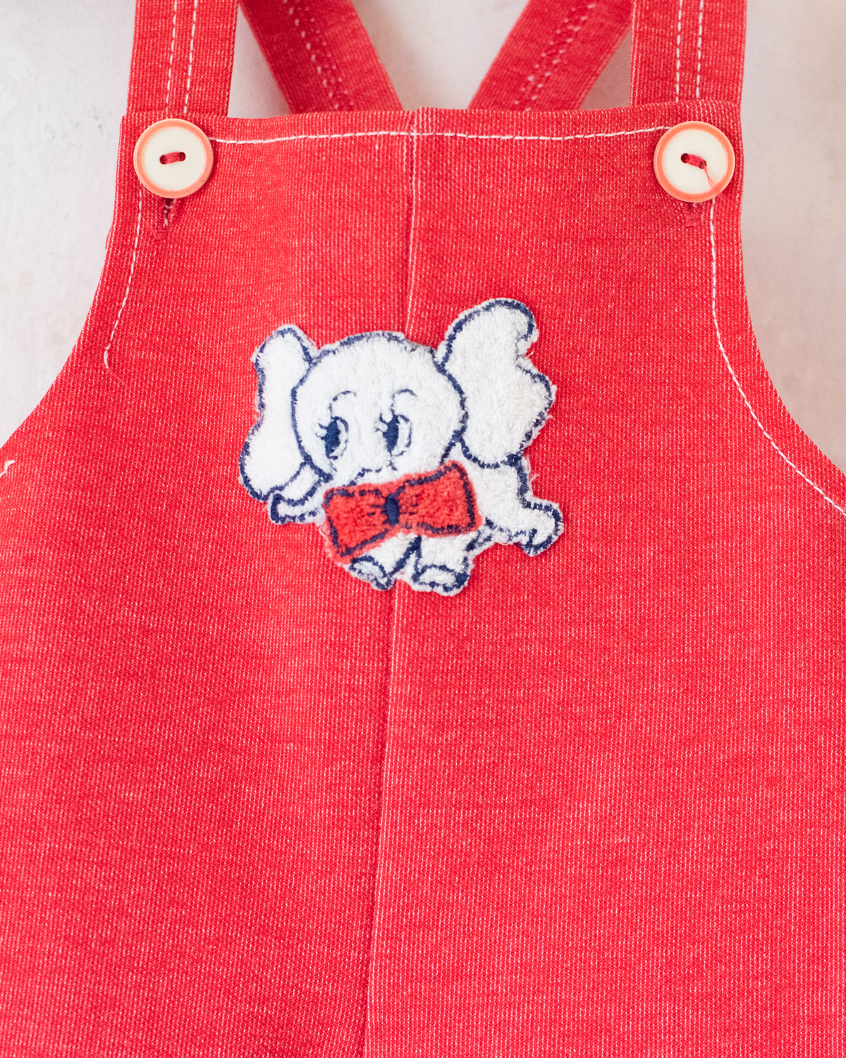 Red 70s jumpsuit with white elephant | 6-9 months