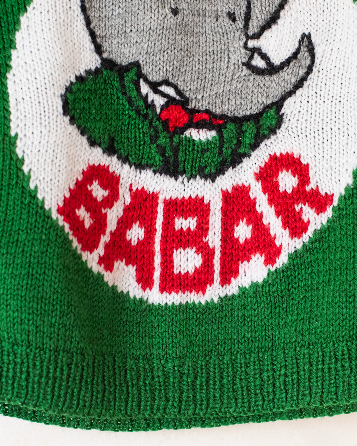 Green sweater with the king in the bar | 3-4 years