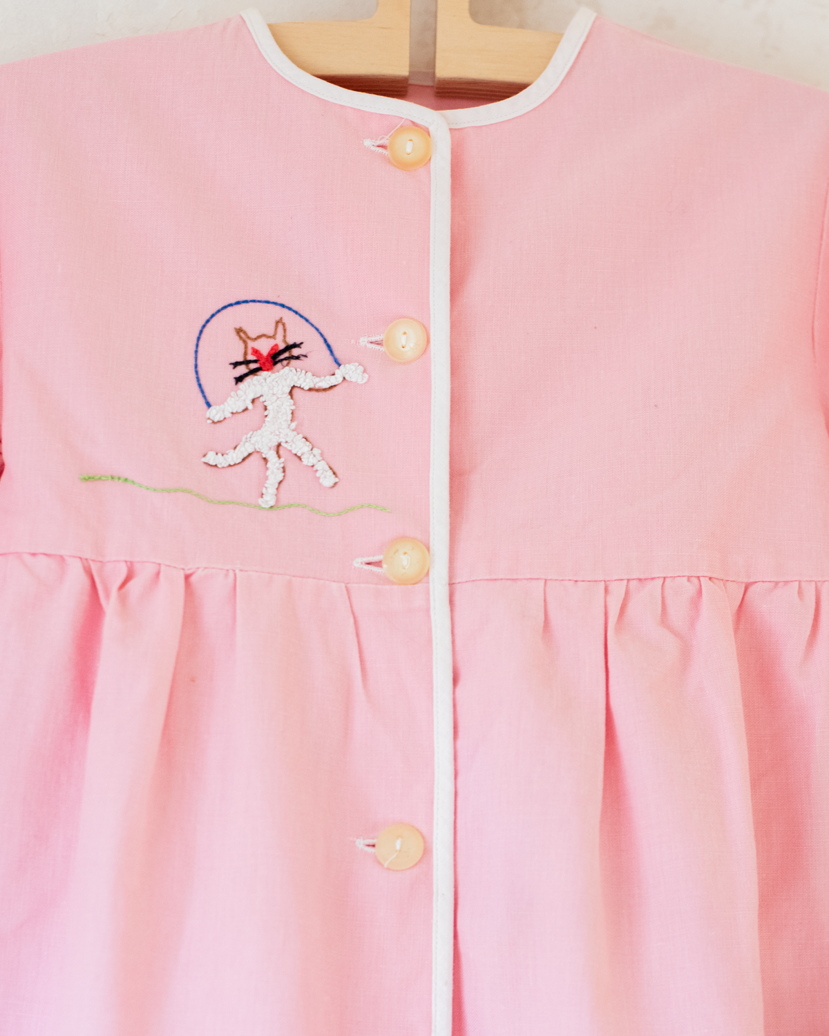 Pink tunic from the 50s with embroidered rabbits | 5-6 years