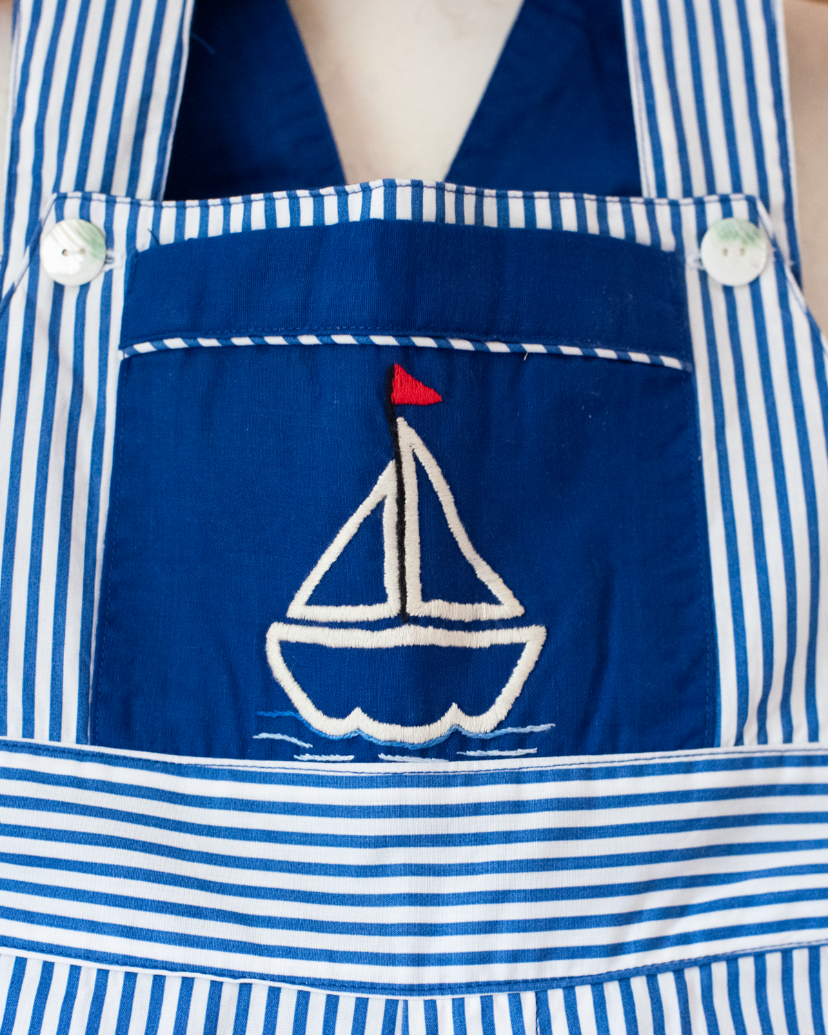 Overalls with blue stripes and an embroidered sailboat | 18-24 months