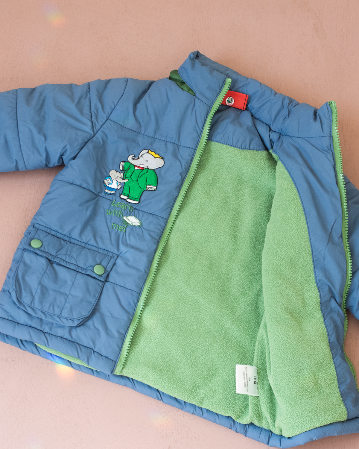 Blue fleece jacket with the king in the bar | 18-24 months