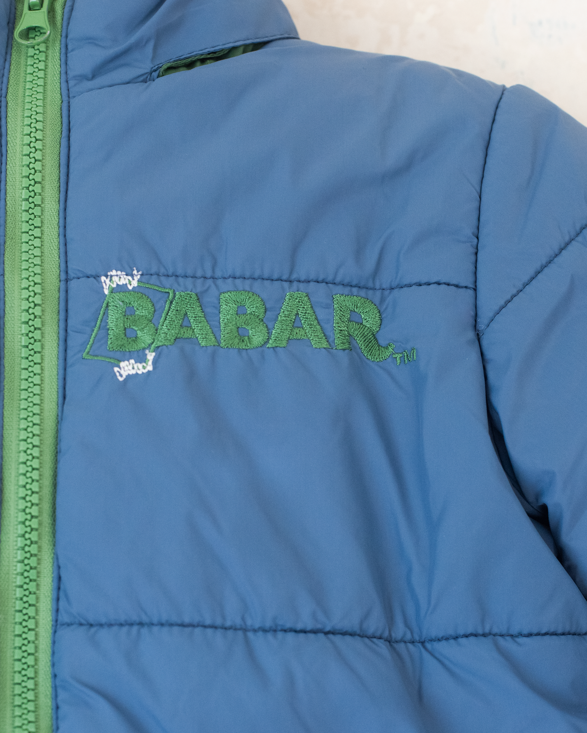 Blue fleece jacket with the king in the bar | 18-24 months