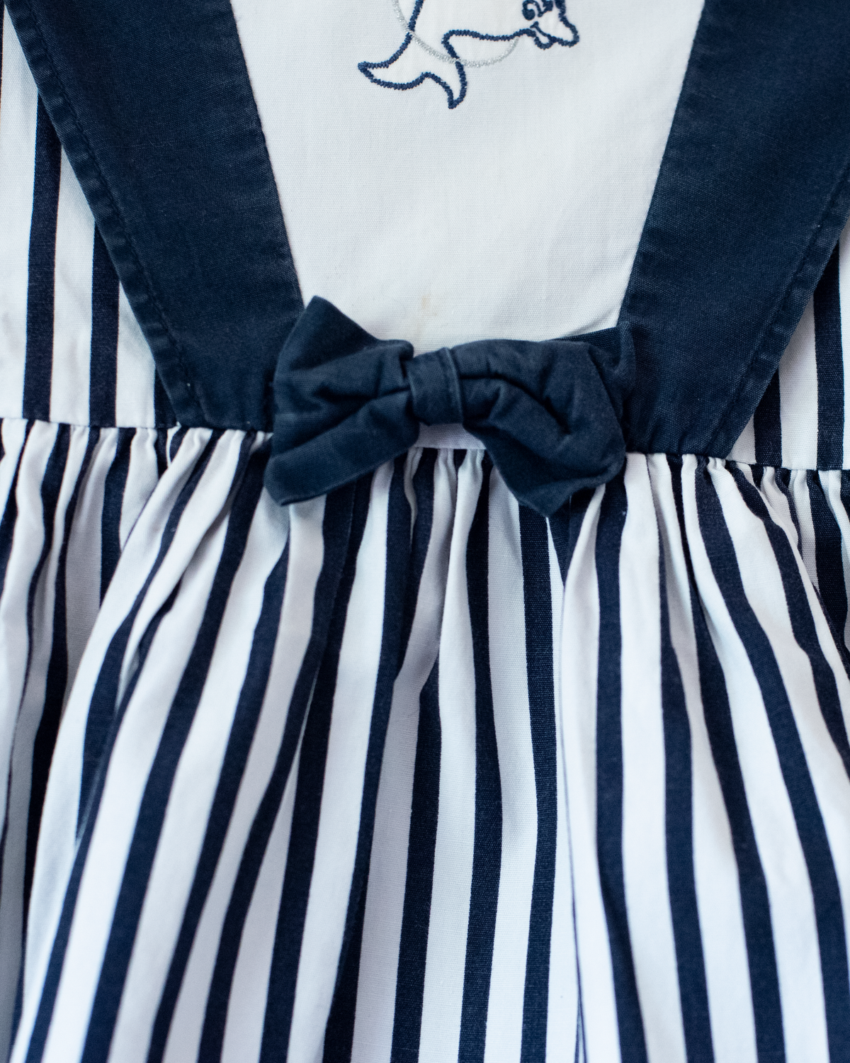 Striped dress, embroidered dolphin and bow tie | 9-12 months