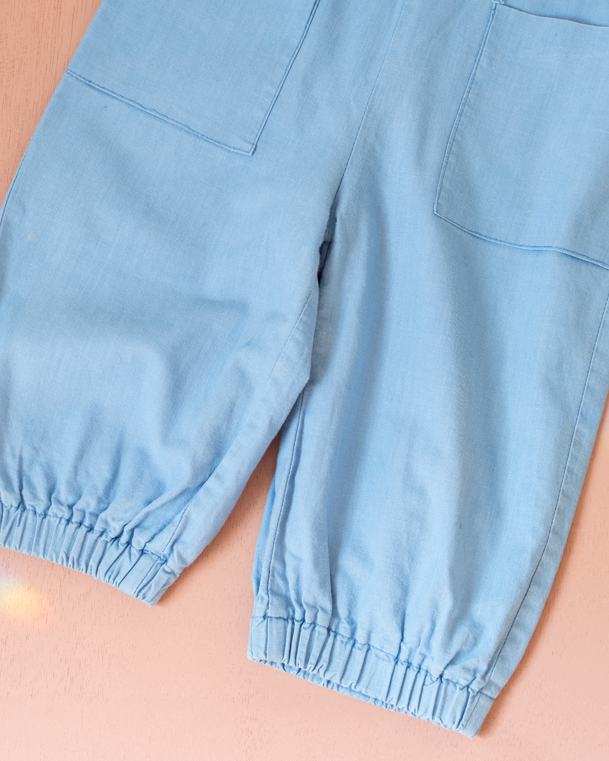 Light blue romper with a sailor on a swing | 12-18 months