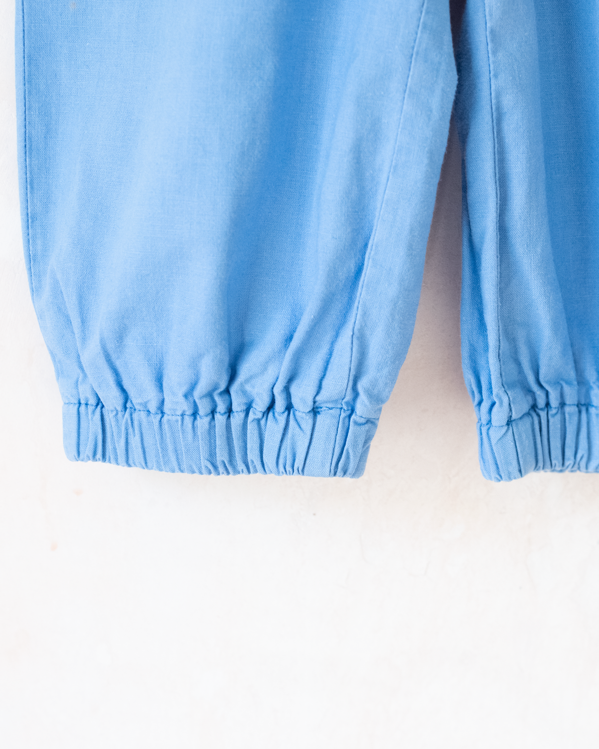 Light blue romper with a sailor on a swing | 12-18 months