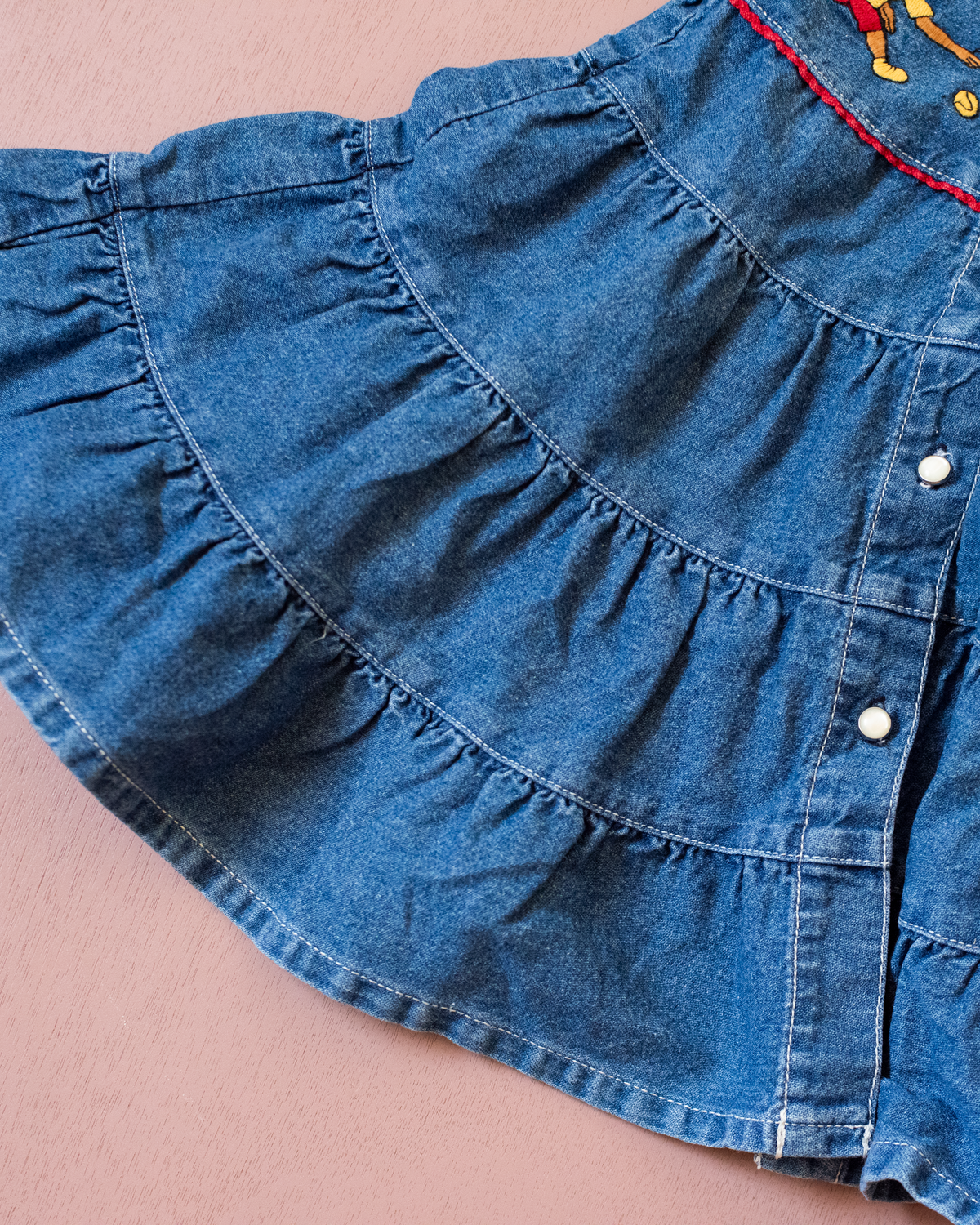Denim dress with embroidery of the King of Bar and Zafir playing | 18-24 months