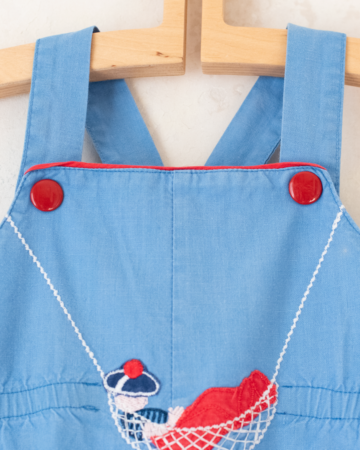 Light blue romper with a sailor on a swing | 12-18 months