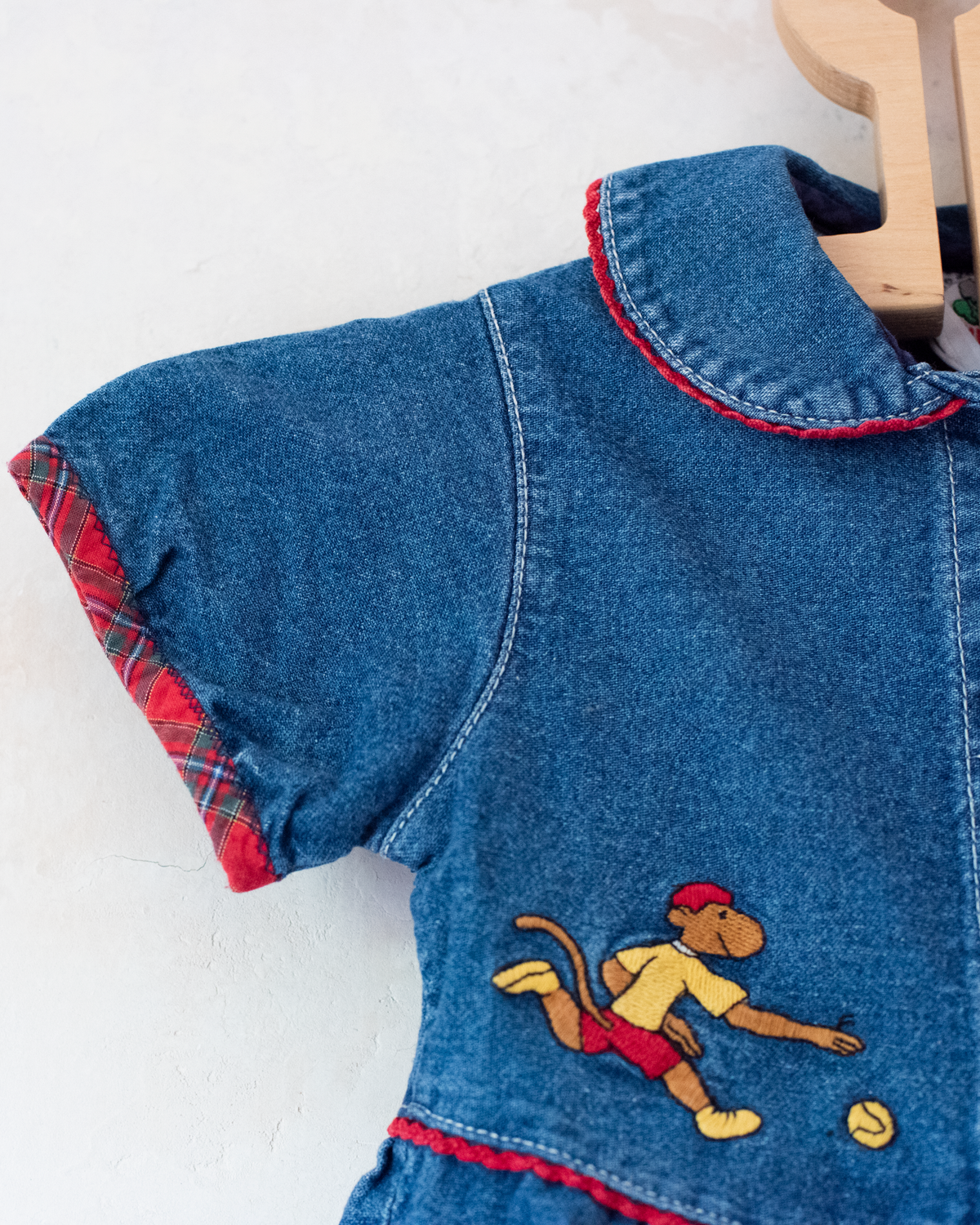 Denim dress with embroidery of the King of Bar and Zafir playing | 18-24 months
