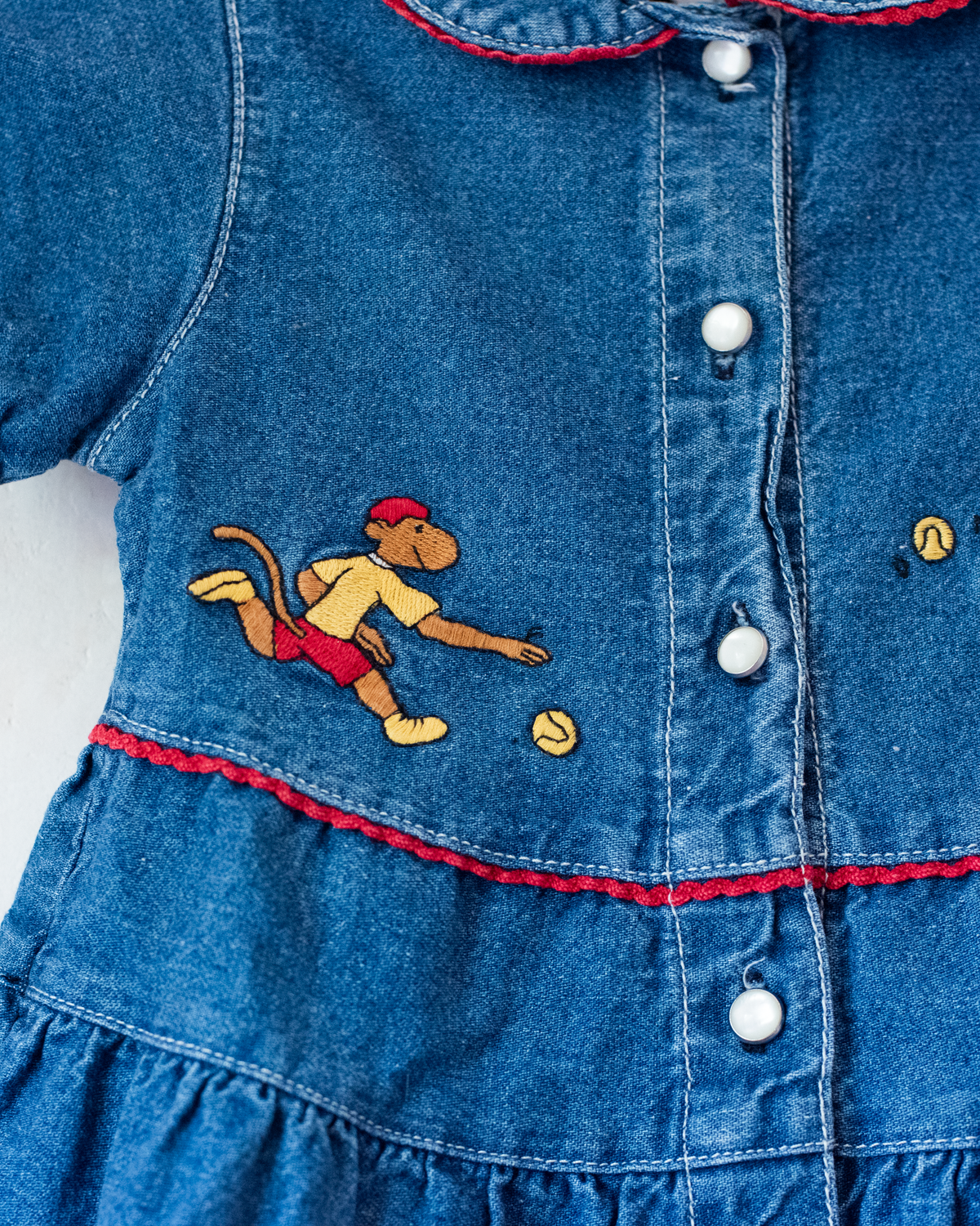 Denim dress with embroidery of the King of Bar and Zafir playing | 18-24 months