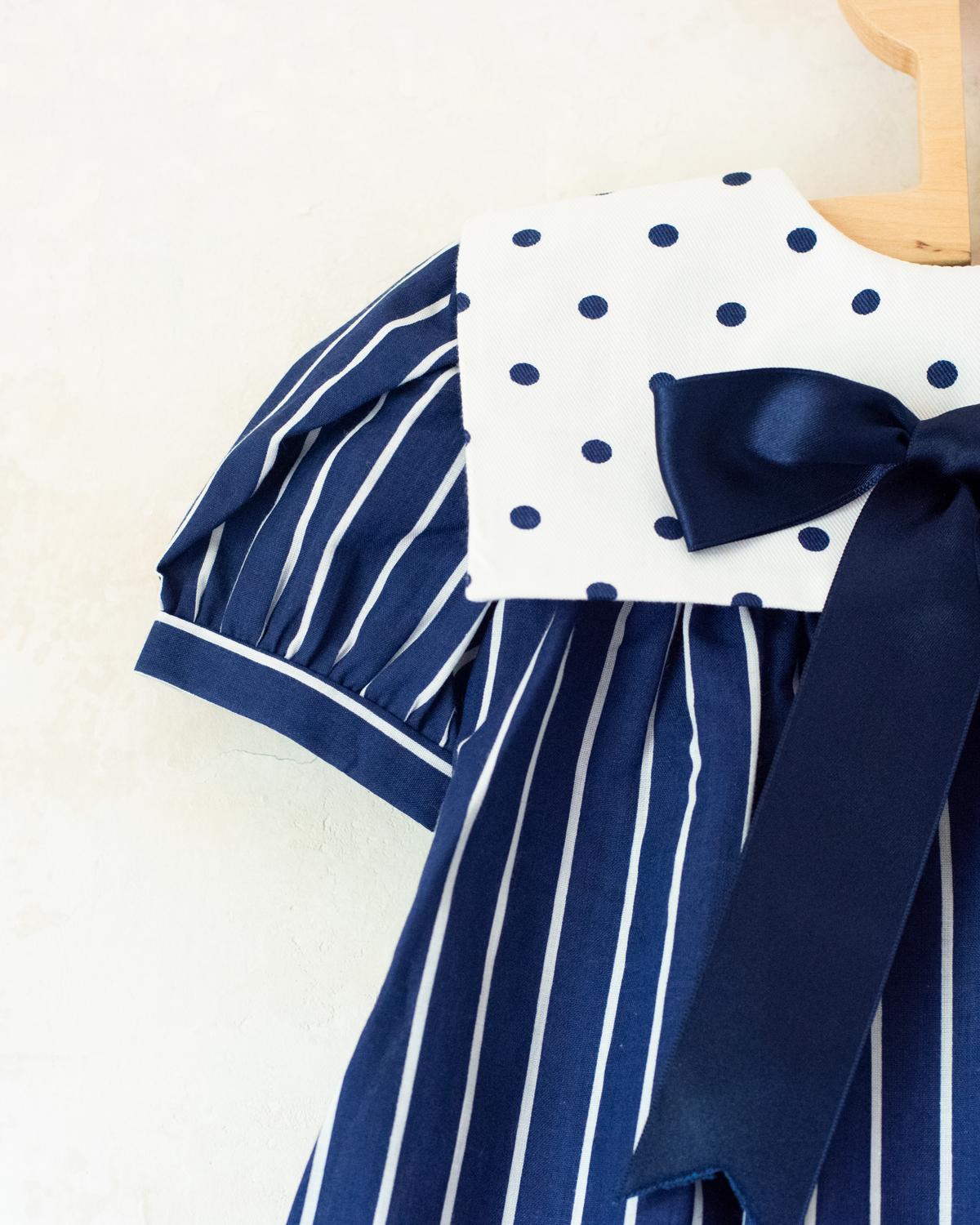 Blue dress with stripes, dots and a large bow tie | Spanish dead stock | 12-18 months